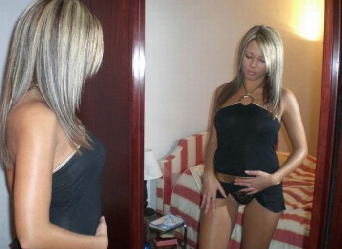 blonde girl amateur taking pictures at home