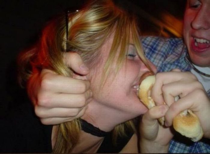 girl eating hot dog