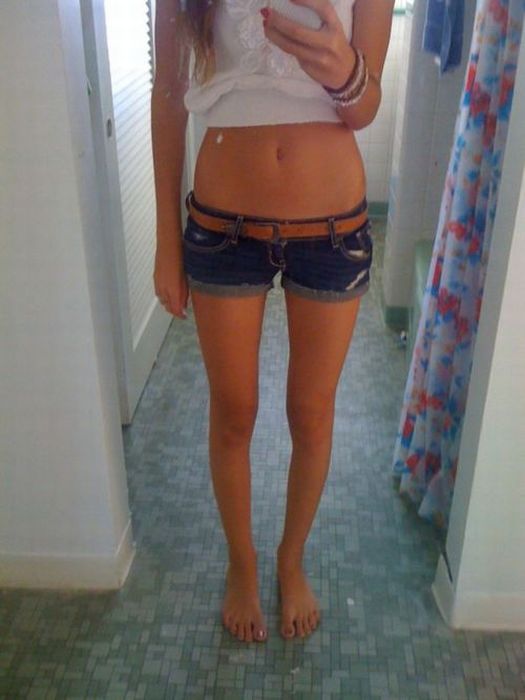 young girl in jean shorts
