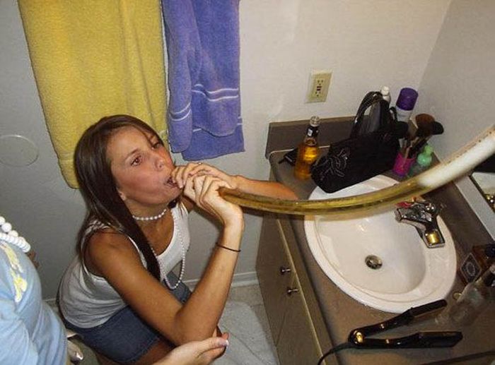 young girl with a beer bong