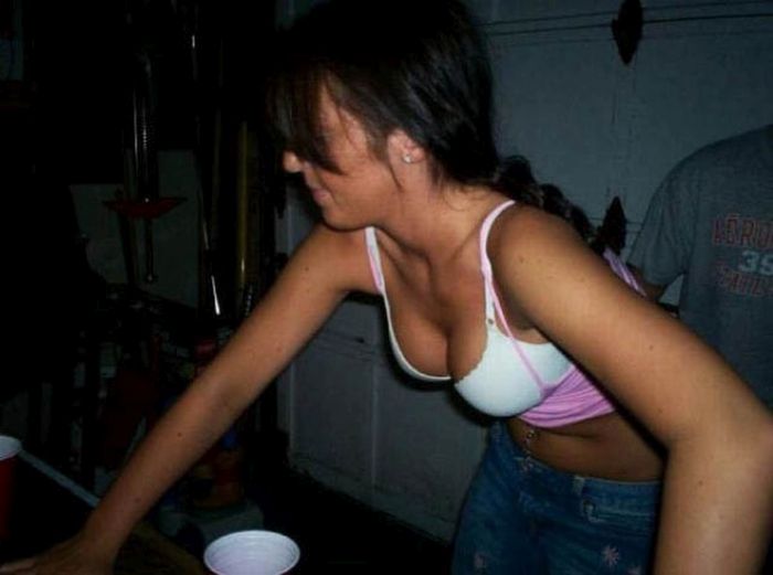 young girls playing beer pong