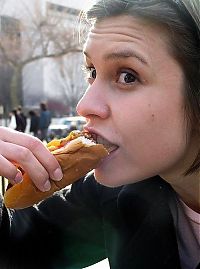 People & Humanity: girl eating hot dog