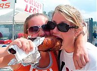 People & Humanity: girls eating a turkey leg