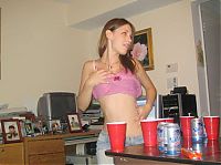 People & Humanity: young girls playing beer pong