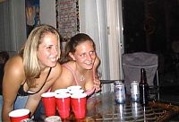 People & Humanity: young girls playing beer pong
