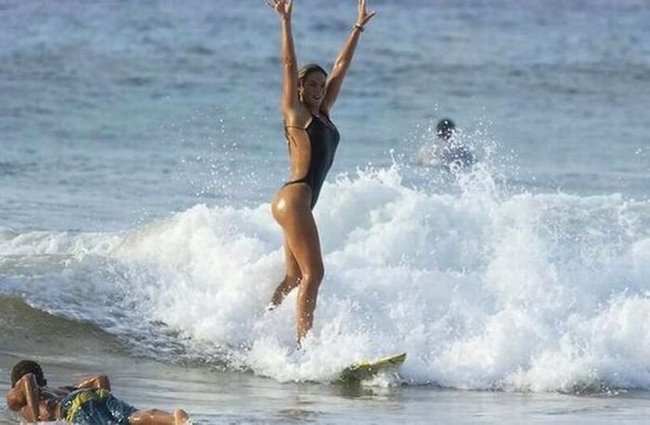 young surfing girl