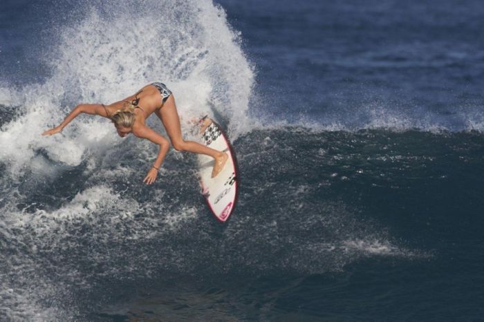 young surfing girl