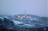 Transport: fishing ship in the middle of a storm